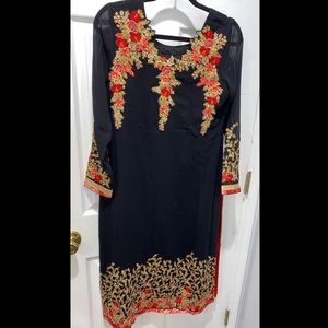 Black dress with gold and red work.